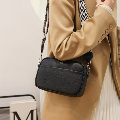 Caliara - kornat läder crossbodyväska